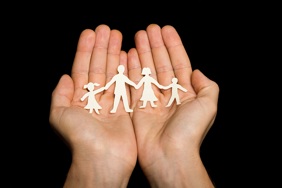 hands holding Paper Family