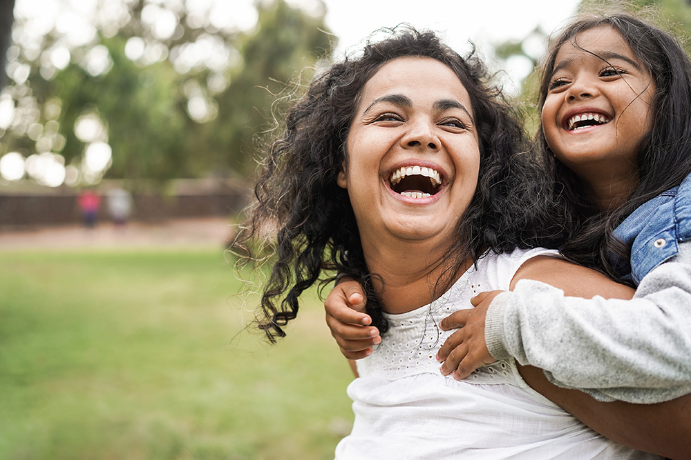 mother laughing with daughter